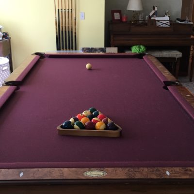 PRICE REDUCED- 8’ Merriville pool table with cherry finish and letter pockets.